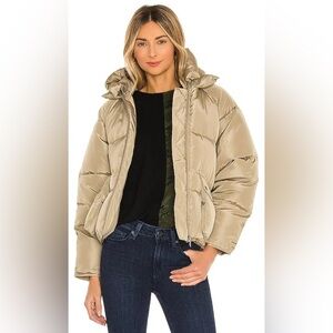 Revolves “Toast Society” Pluto Puffer Jacket in Tan
